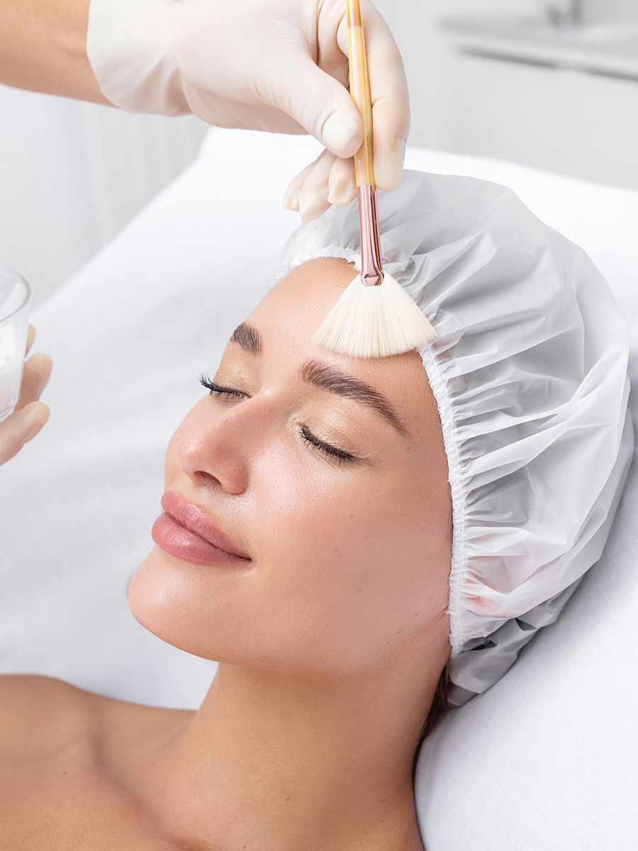 Woman at a spa getting a chemical peel