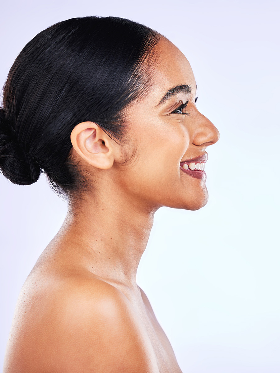 Profile of a young woman smiling