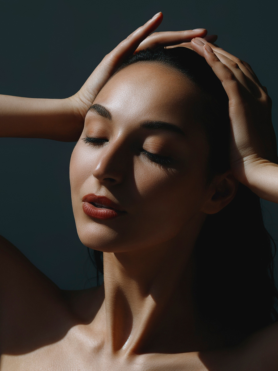 woman with her hands on her head