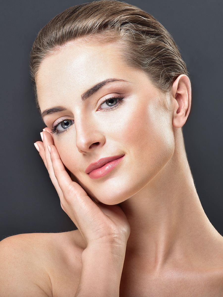 Woman touching her face