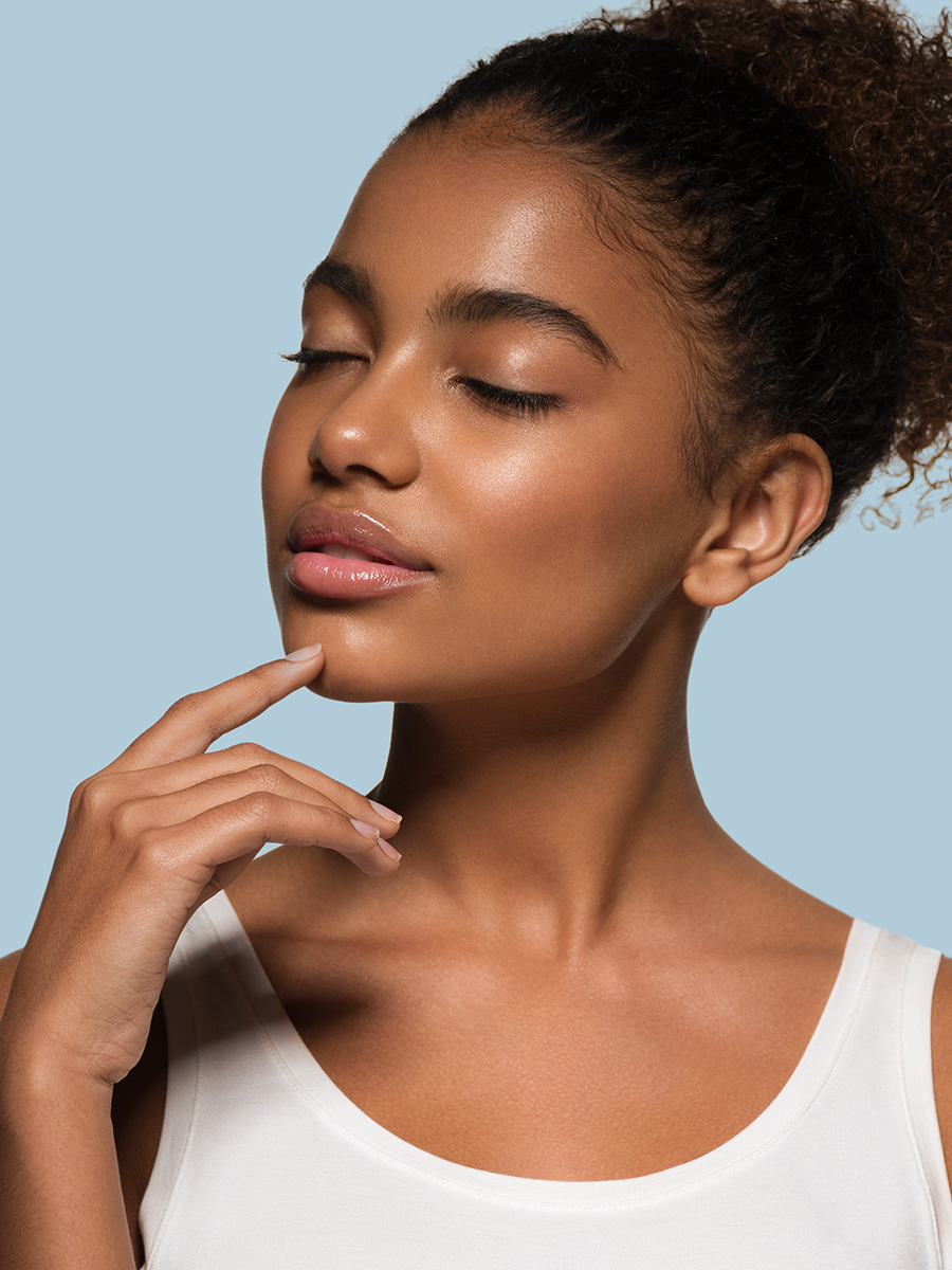 Young woman touching her chin