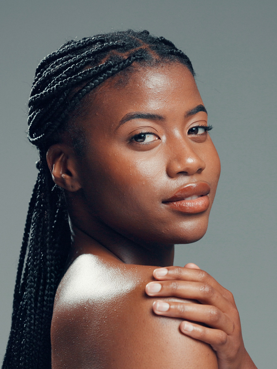 Young woman looking over her shoulder