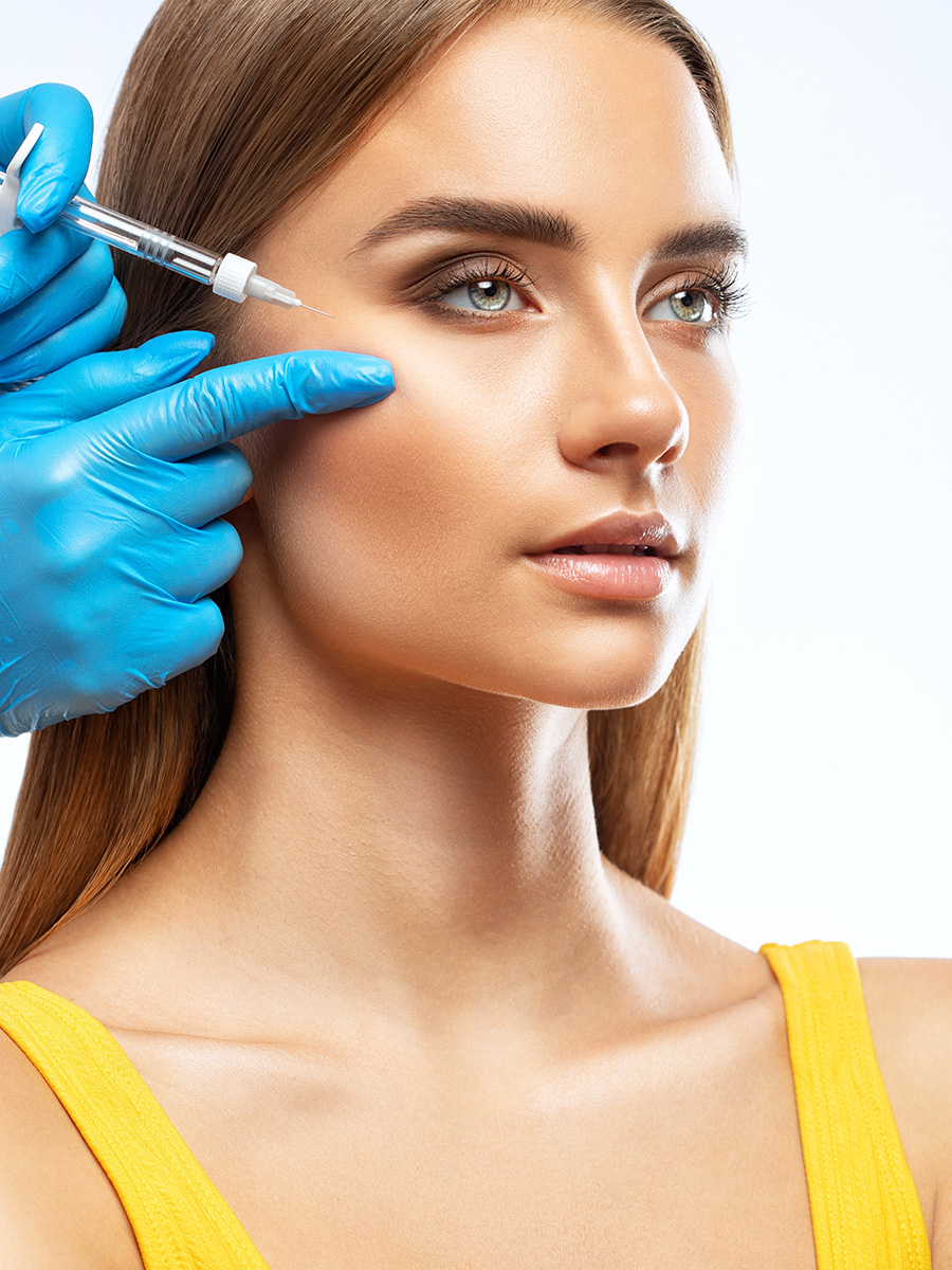 A woman getting an injection on her cheek