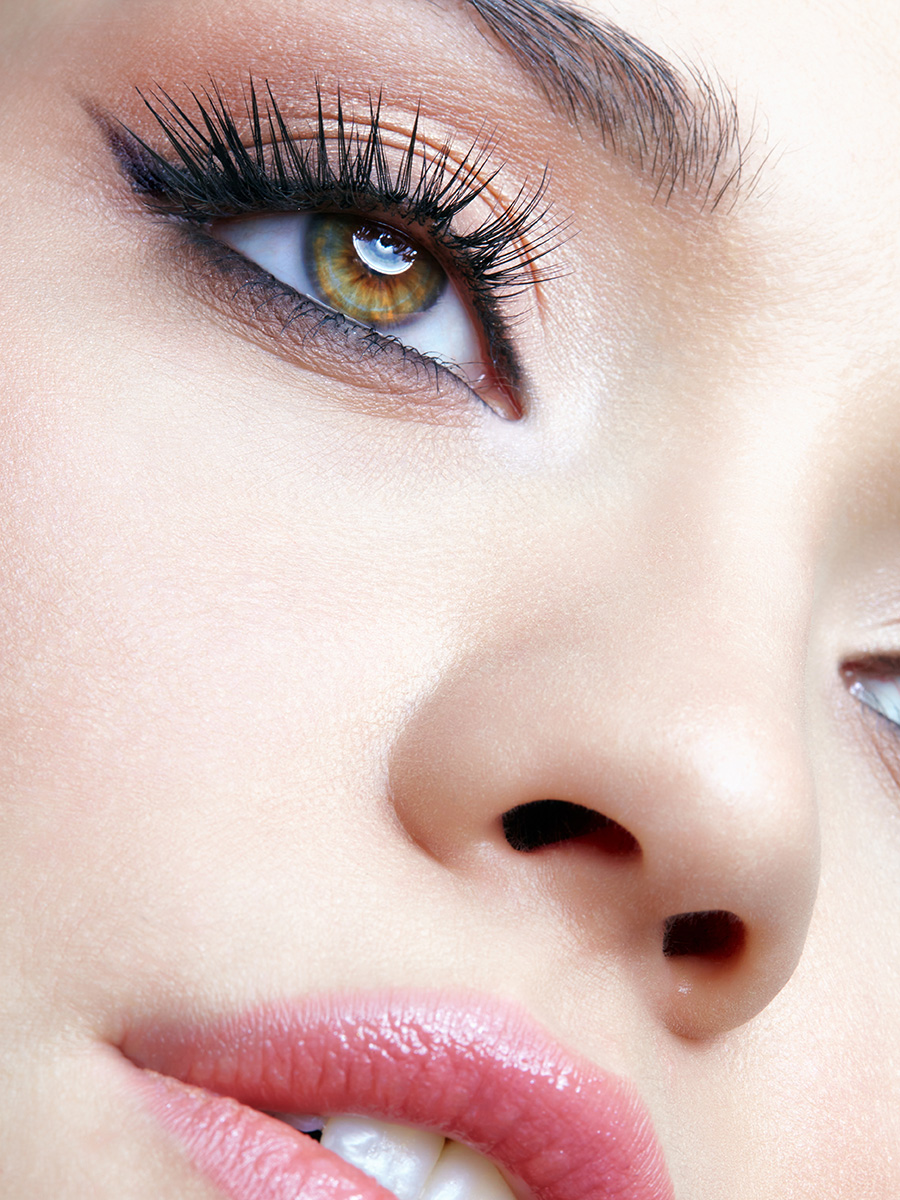 Woman with green eyes and pink lipstick