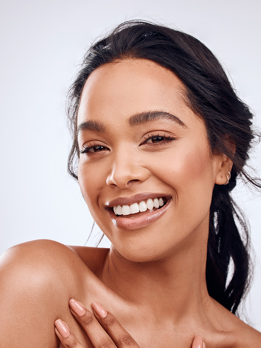 Young woman with dark hair smiling