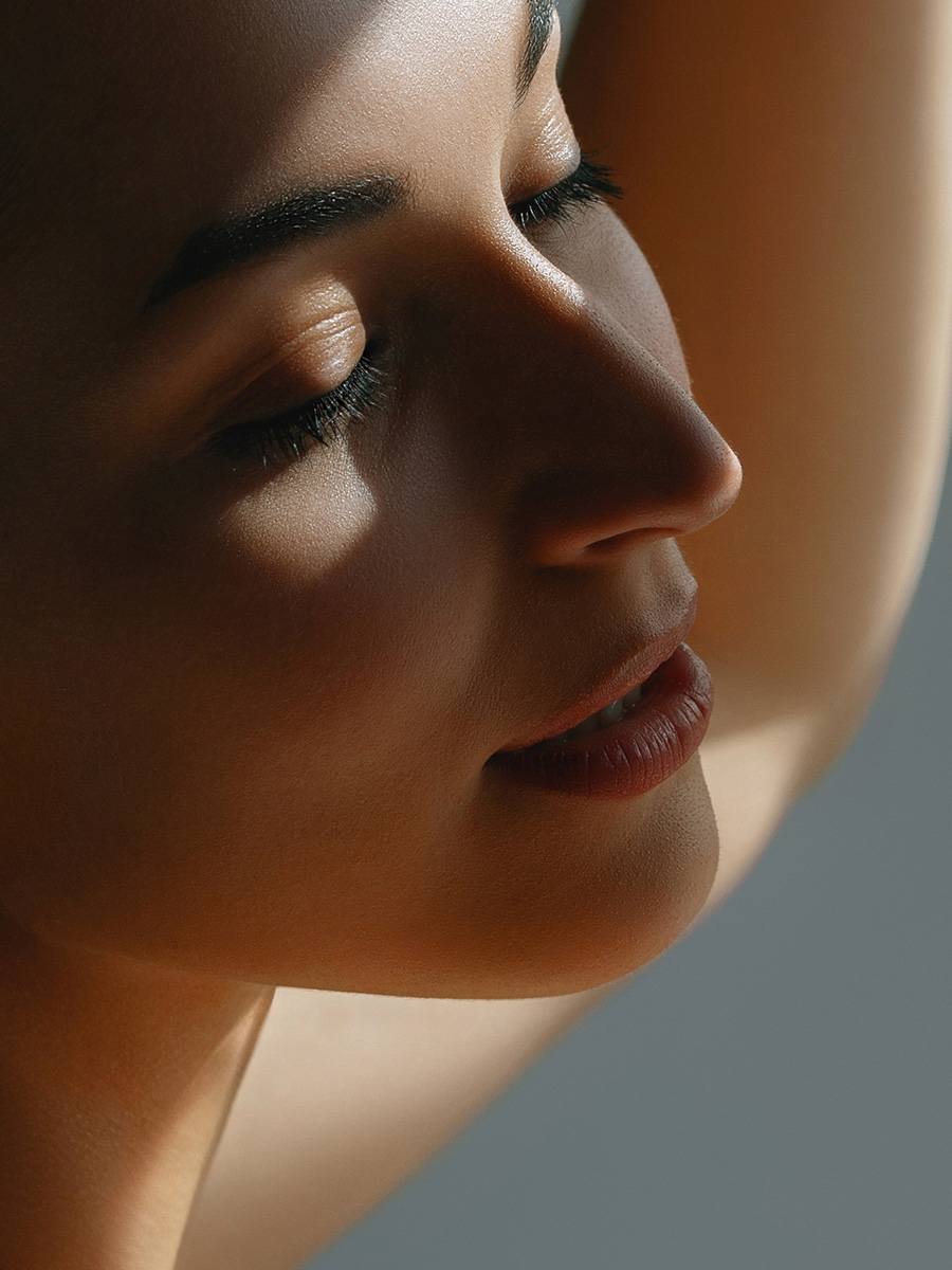 woman with a shadow cast over her face