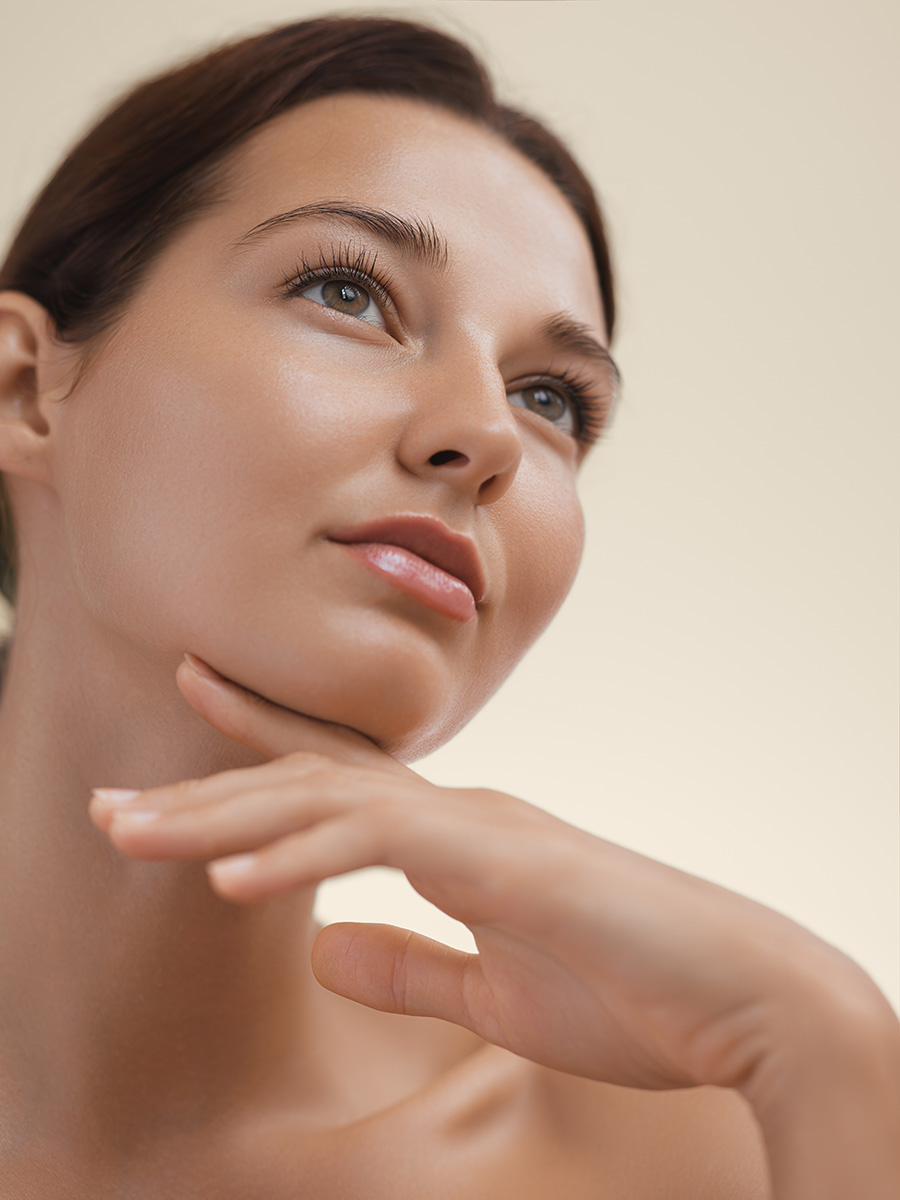 Young woman touching her chin