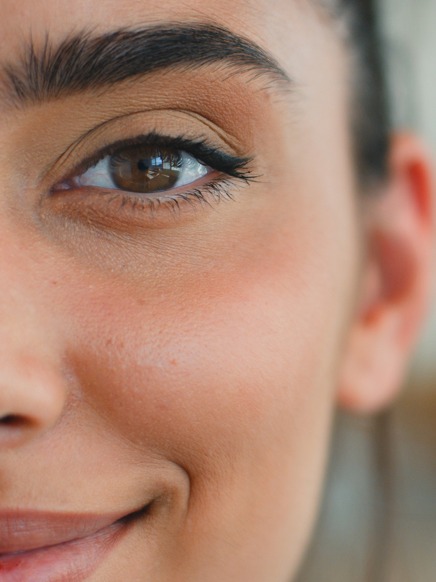 Up close of a woman's eye and smile